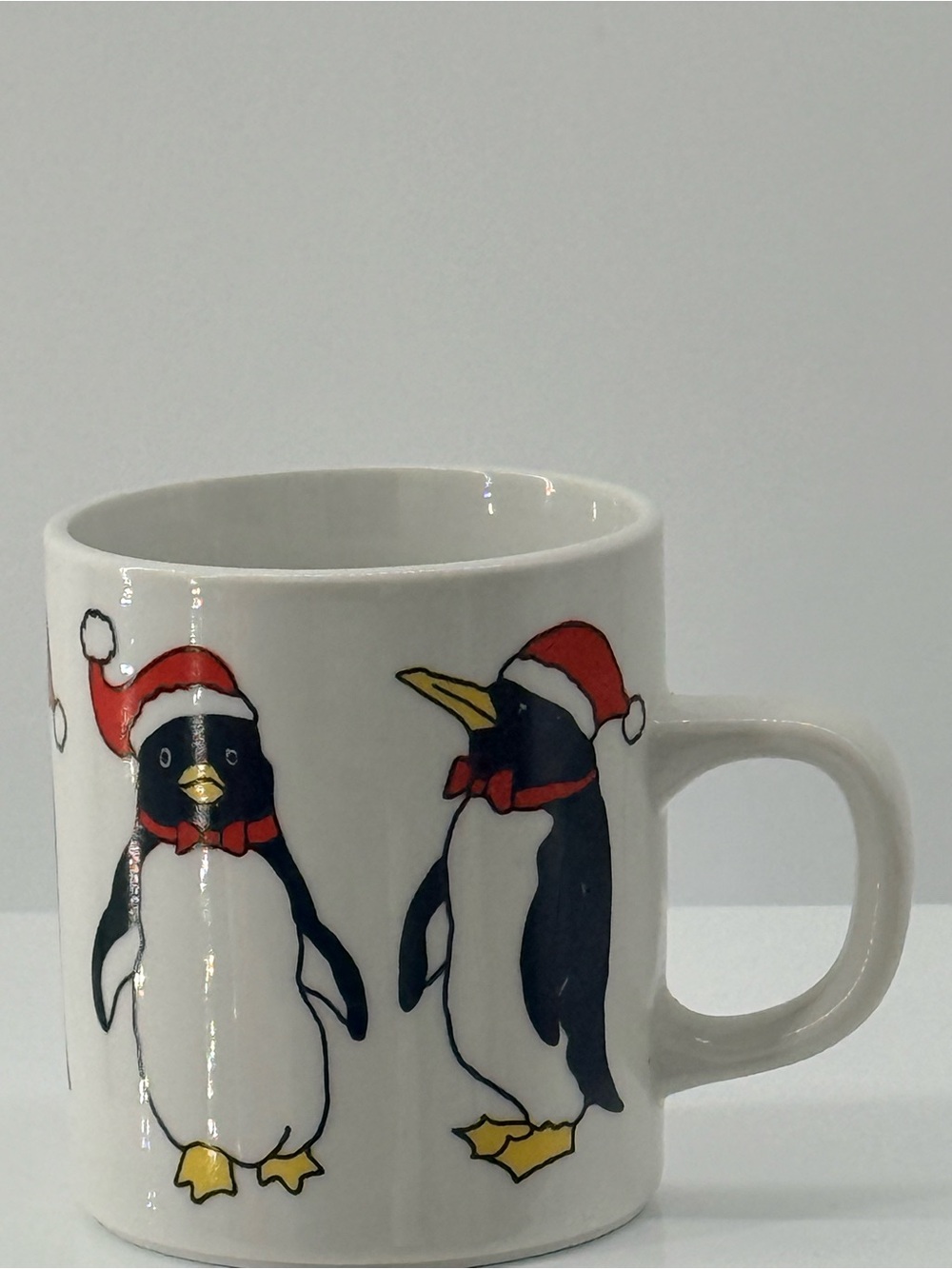 Festive Penguin Ceramic Mug in White with Red Accents